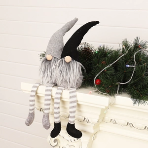 Pair of gray and black Christmas gnomes with long legs for festive shelf decorations