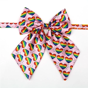 Pink JK style dog bowtie with colorful rainbow heart patterns and satin finish
