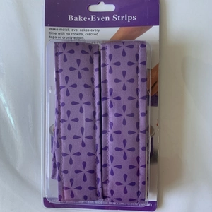 Macro detail of purple fabric Bake-Even Strips with geometric patterns for cake pans