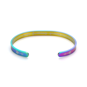 Detailed view of iridescent titanium cuff bracelet with keep fucking going engraving