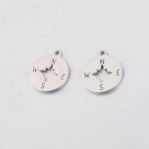 Polished stainless steel compass pendant with hollow star and engraved direction letters