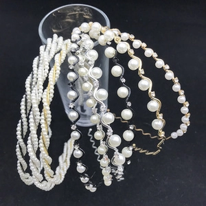 Set of four handmade pearl and rhinestone headbands with metal wave and gold wire designs