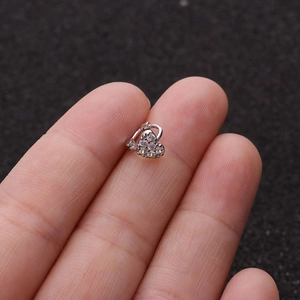 Close-up of silver heart-shaped earrings with micro-pave cubic zirconia crystals