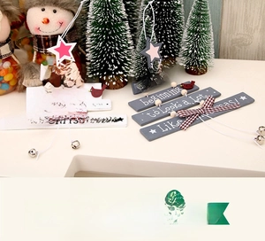 Close-up of wooden Christmas tree ornaments with stars, birds, and silver bells