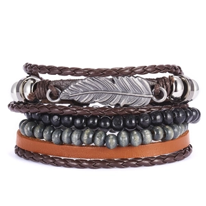 Handmade multilayer leather bracelet with wooden beads and silver feather charm