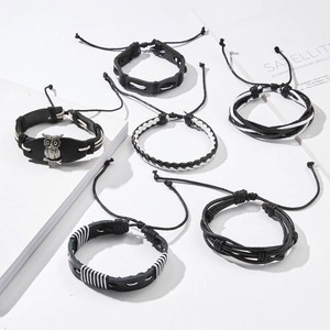 Detailed view of 6-piece men's leather bracelet set with adjustable ties and owl charm