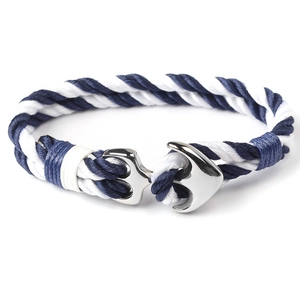 Detail of blue and white nylon rope weave with a silver stainless steel anchor buckle