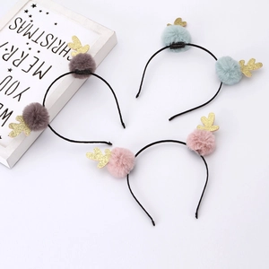 Christmas reindeer antler headbands in pink, green, and grey with faux rabbit fur balls