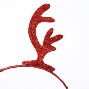 Close-up of a festive red glitter reindeer antler headband for holiday parties