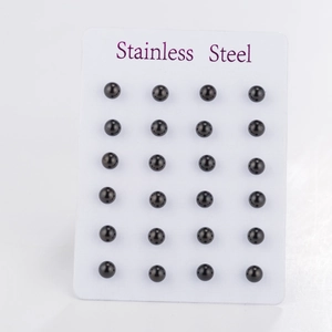 Set of 12 pairs of black stainless steel ball earrings on a white display card