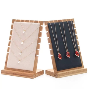 Bamboo wood jewelry display stands with beige and black velvet for necklace storage