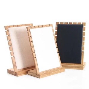 Bamboo necklace display stands with multi-slot fabric padding in beige, white, and black