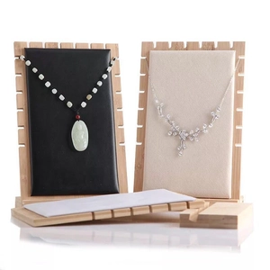 Bamboo necklace display stand with black and beige PU leather panels for jewelry storage