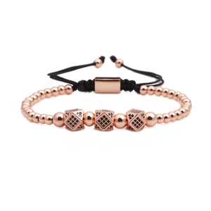 Rose gold crown beaded bracelet with black cubic zircon cubes on woven adjustable cord