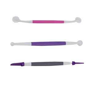 Macro view of a 3-piece set of dual-head plastic cake decorating and fondant modeling tools