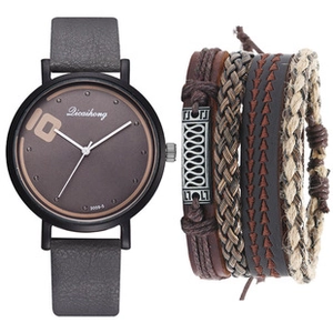 Detail of multi-layer leather bracelets with a matching analog watch on white background