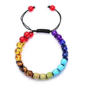 Detail of colorful natural stone beads and adjustable black braided cord on a handmade bracelet