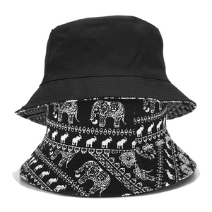Double-sided reversible bucket hat with black and white elephant print pattern