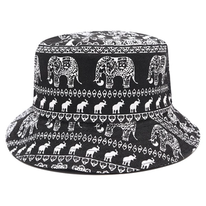 Double-sided bucket hat featuring ethnic elephant print in black and white canvas