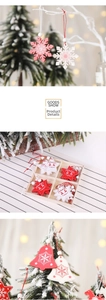 Macro detail of red and white wooden Christmas tree ornaments with reindeer and snowflake patterns