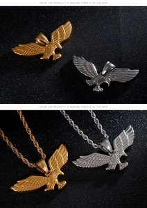 Detail shot of titanium steel eagle pendants in gold and silver with twisted chain