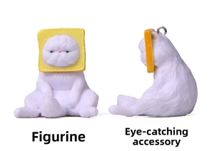 Detail of white Persian cat figurine wearing toast headwear with metal hanging ring