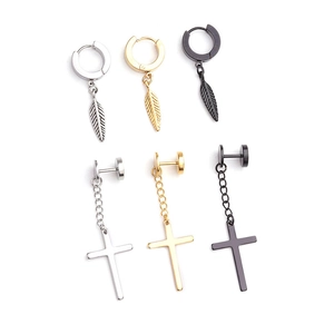 Detail view of cross and feather earrings in silver, gold, and black finishes