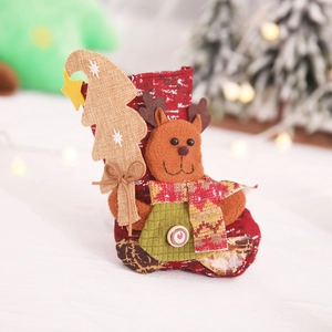 Red Christmas stocking with plush reindeer and wood button decoration for holiday trees