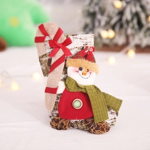 Christmas stocking featuring a snowman with candy cane and festive wood grain pattern