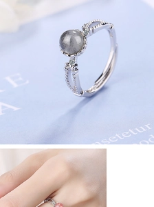 Detailed view of pink strawberry crystal and moonstone adjustable rings in S925 silver