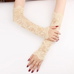 Close-up of floral hollow lace arm sleeves in beige with delicate scalloped edges