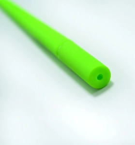 Macro detail of fluorescent green silicone tube showing smooth cut and hollow structure