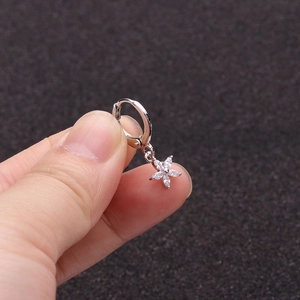 Detailed close-up of a silver sunflower hoop earring with micro-pave cubic zirconia