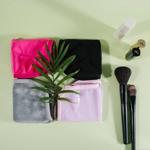 Microfiber makeup remover cloth set in four colors with luxury spa setting background