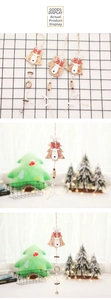 Detail of wooden Christmas ornaments featuring reindeer motifs, bells, and mini clips