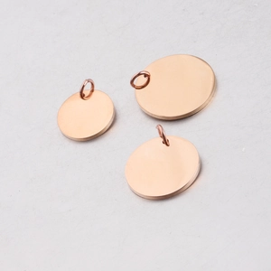 Three rose gold stainless steel round disc pendants in different sizes for DIY jewelry