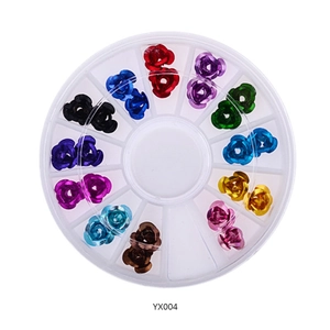 Detailed top view of 12-color rose metal nail art charms in a round wheel organizer