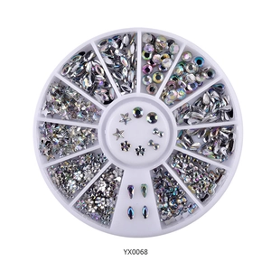 Detailed top view of a round wheel box filled with colorful AB rhinestones for DIY nail art