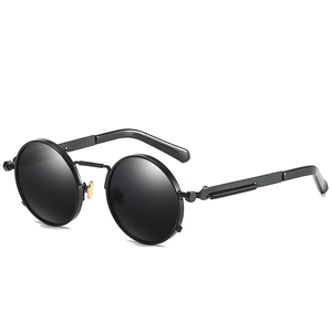 Steampunk polarized round sunglasses with black metal frame and gold nose bridge detail