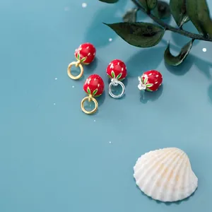 Detail of strawberry charm with red enamel and gold lacquer for DIY jewelry making