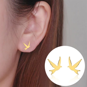 Golden minimalist swallow bird stud earrings for women with high polish finish