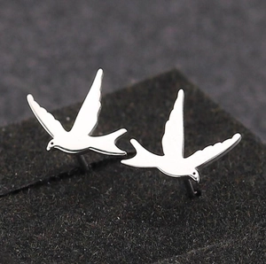 Polished silver sparrow stud earrings for women in a cute minimalist bird design