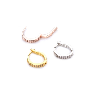 Micro-pave zircon hoop earrings in rose gold, gold and silver finishes on white background