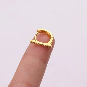Detail of gold T-bar ear cuff with micro-pave cubic zirconia on fingertips
