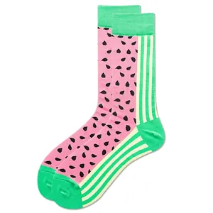 Detail of pink cotton mid-calf socks featuring black watermelon seed patterns and green accents