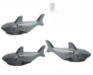Macro view of gray plastic shark toy assembly with detachable head and side gill details