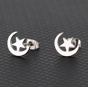 Elegant silver star and crescent moon stud earrings with a polished metallic finish