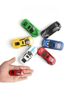 Miniature alloy toy cars shown in palm to demonstrate portable pocket size for kids