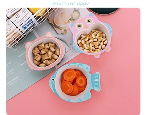 Close-up of bamboo fiber kids bowls featuring cute animal shapes on a pink table