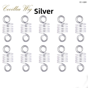 Macro view of ten silver hollow embossed hair rings for dreadlocks and DIY braiding